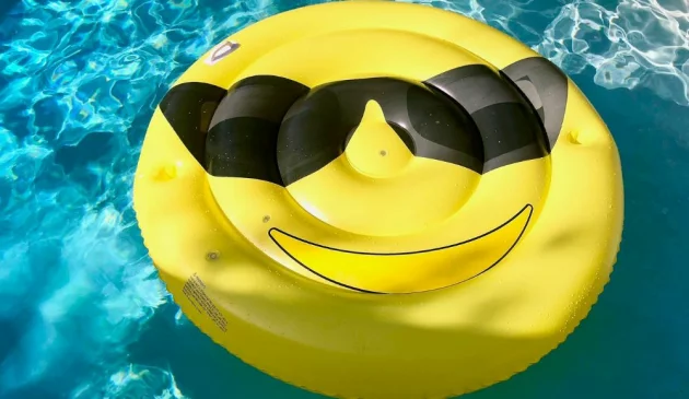 Smiley face inflatable in a pool