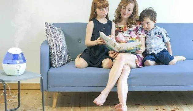 Mum and children sitting on a sofa