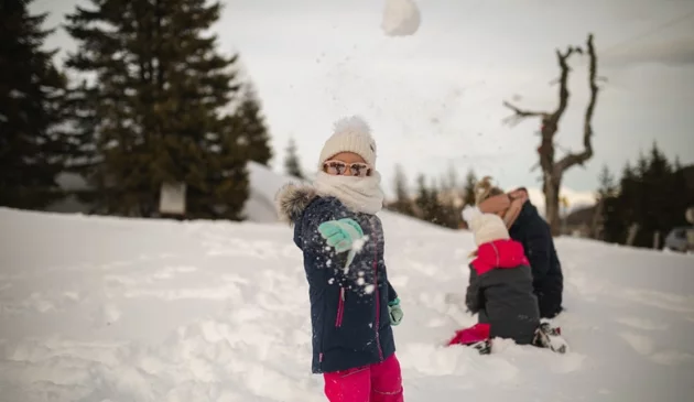 Child wearing a scarf in the snow