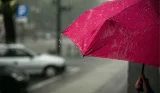 Woman holding an umbrella in the rain