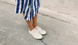 Woman wearing white trainers