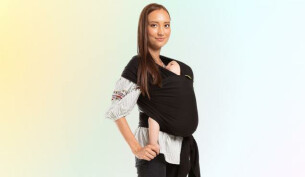 Woman wearing Boba Wrap with baby inside