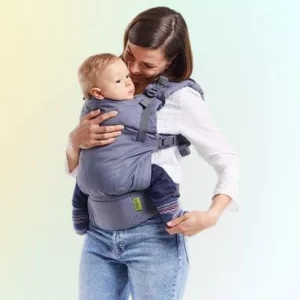 Woman wearing Boba X baby carrier with baby inside