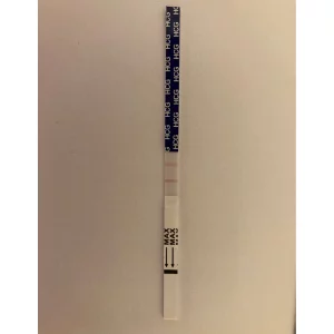 Boots pregnancy test strip after use showing positive result