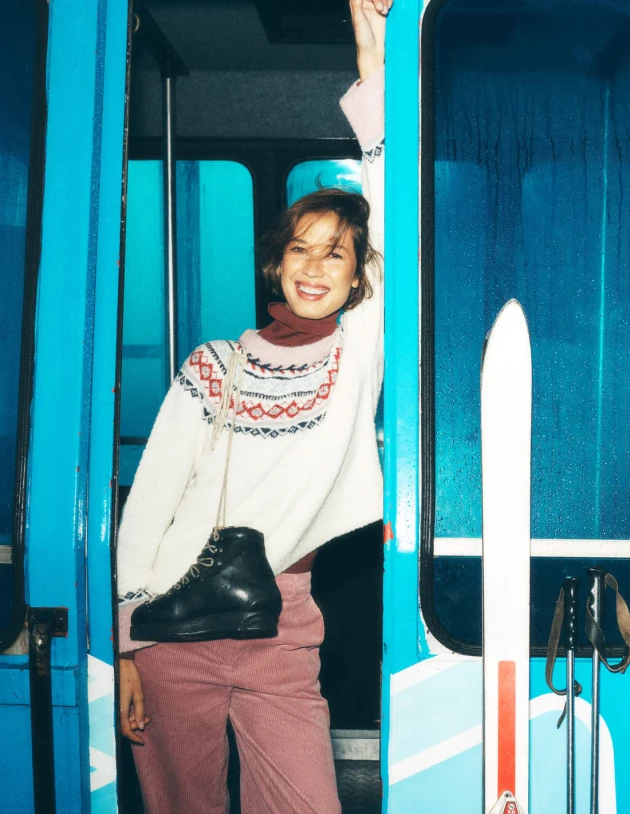 A model wears Boden's Bouclé Raglan Jumper