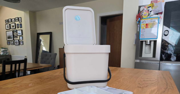 The Brabantia Sort & Go Waste Bin 6L with its lid open atop a table