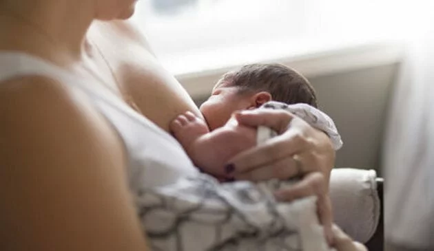 Woman breastfeeding a baby