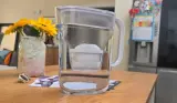 The Brita Style Essential Water Filter Jug on top of a kitchen counter filled with water