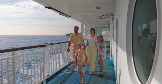 Brittany Ferries promotional image showing happy family walking along ferry