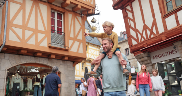 Brittany Ferries promotional image showing boy and man shopping on holiday