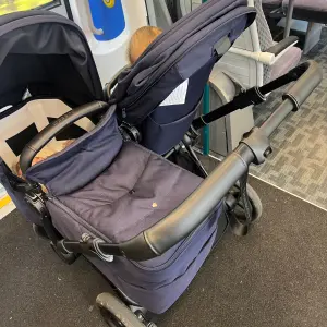 Bugaboo Donkey 6 double buggy on a train