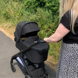 Woman pushing Bugaboo Dragonfly