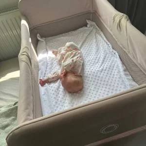 Bugaboo Stardust Travel Cot with newborn baby