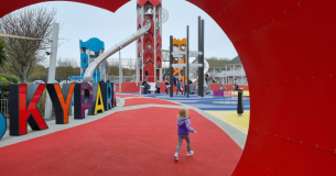 Toddler running into Butlin's Skypark playground
