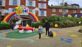 A family walking into the entrance of the CBeebies Land Hotel