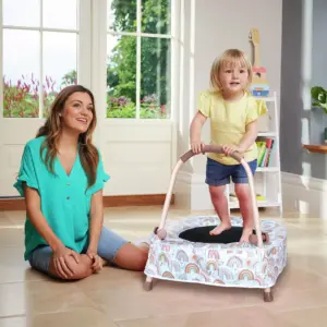 Child on Chad Valley Toddler Trampoline indoors