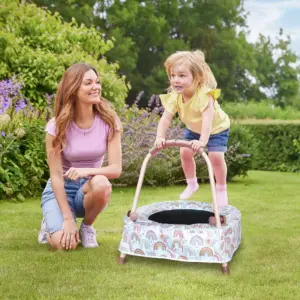 Child on Chad Valley Toddler Trampoline in garden