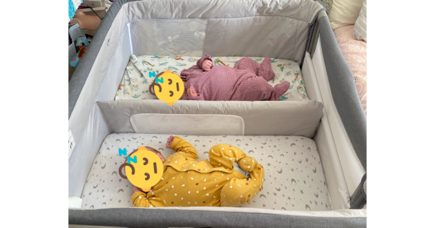 Chicco Next2Me Twins Crib review image featuring crib in testing with real babies