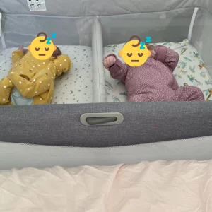 Chicco Next2Me Twins Crib review image featuring crib in testing with real babies