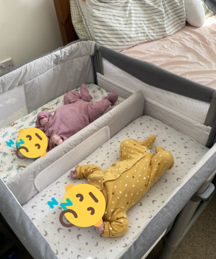 Chicco Next2Me Twins Crib review image featuring crib in testing with real babies