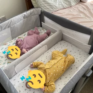 Chicco Next2Me Twins Crib review image featuring crib in testing with real babies