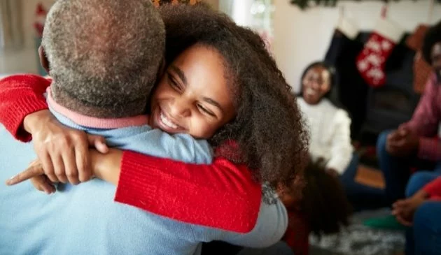 happy child hugging grandfather