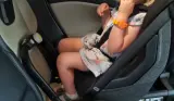 Child in extended rear facing car seat