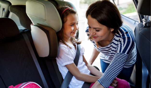 Child in high back booster seat