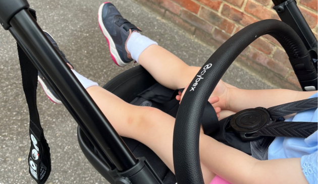 child lying down in Cybex e-Gazelle S stroller