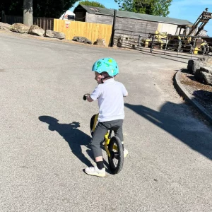 Child riding Hornit AIRO 14 balance bike