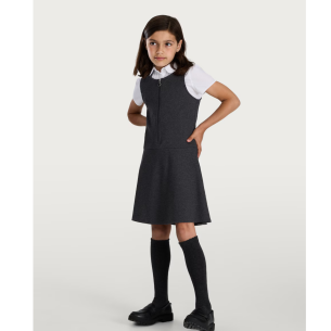 Child wearing pinafore