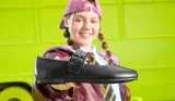 Girl holding Clarks school shoe