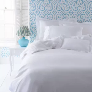 Cologne and Cotton Celeste bedding set on a double bed in a soft neutral bedroom