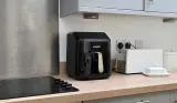 Cookworks 5L Air Fryer on a wooden kitchen worktop beside a hob.