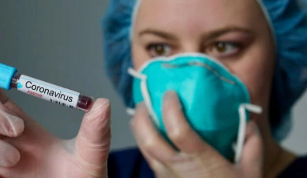 medical researcher with syringe