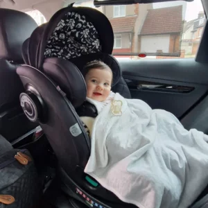 Baby in Cosatto car seat