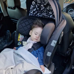Baby sleeping in Cosatto car seat
