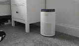 A shot of the Coway Airmega 50 Air Purifier in a bedroom