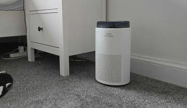 A shot of the Coway Airmega 50 Air Purifier in a bedroom