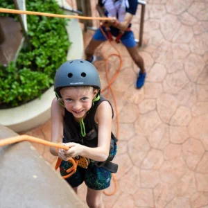 A child climbing at the Crown Paradise Club Cancun