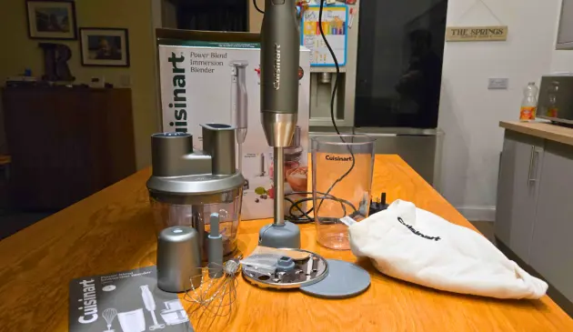 A view of the Cuisinart Power Blend Immersion Blender with all the parts atop a kitchen counter