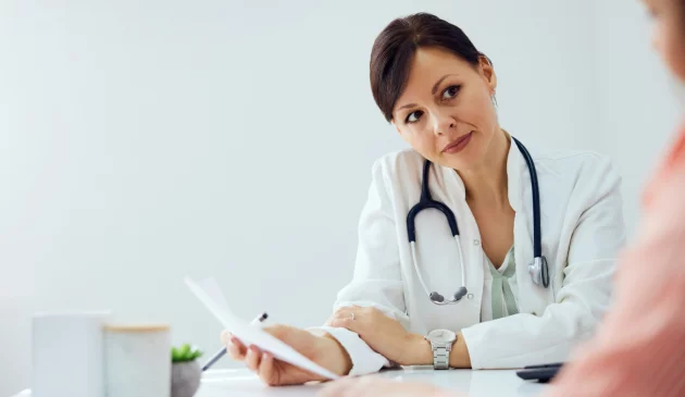 A woman is speaking to her doctor