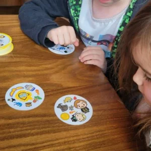Children playing Harry Potter Dobble