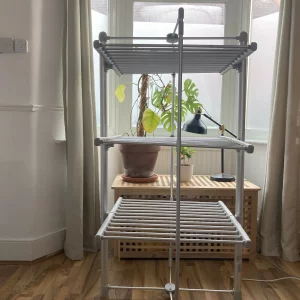Journalist Rachel Erdos hand testing the Dry:Soon Three Tier Heated Airer