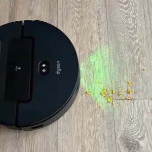 Dyson Spot + Scrub AI robot vacuum cleaning up cereal