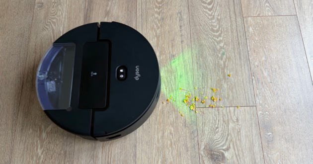 Dyson Spot + Scrub AI robot vacuum cleaning up cereal
