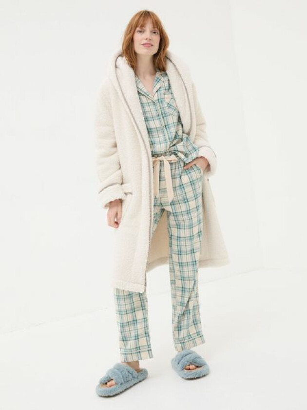 A model wears FatFace's Ivory Snuggle Dressing Gown