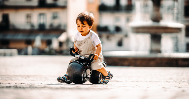 Child riding Early Rider Super Velio