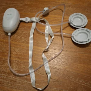 Elvie stride 2 breast pump review image of pump motor, tubes and caps