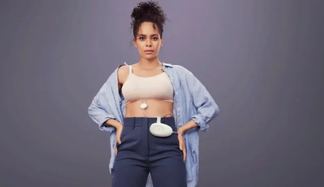 Woman wearing Elvie Stride breast pump